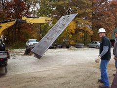 Joe Hottinger helping move the sculpture on to the truck for installation.